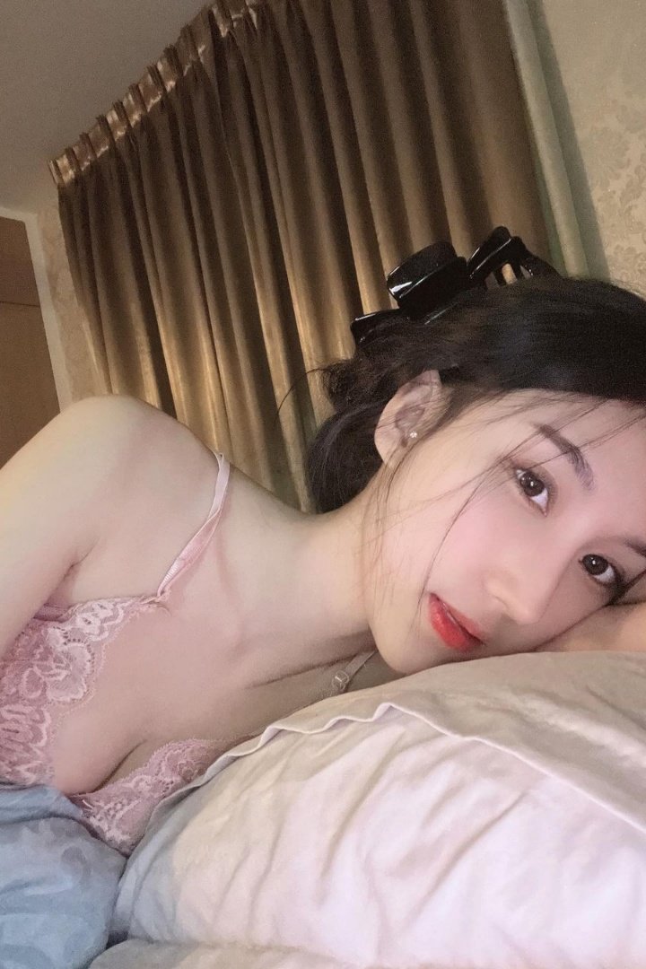 Woman relaxing in bed.