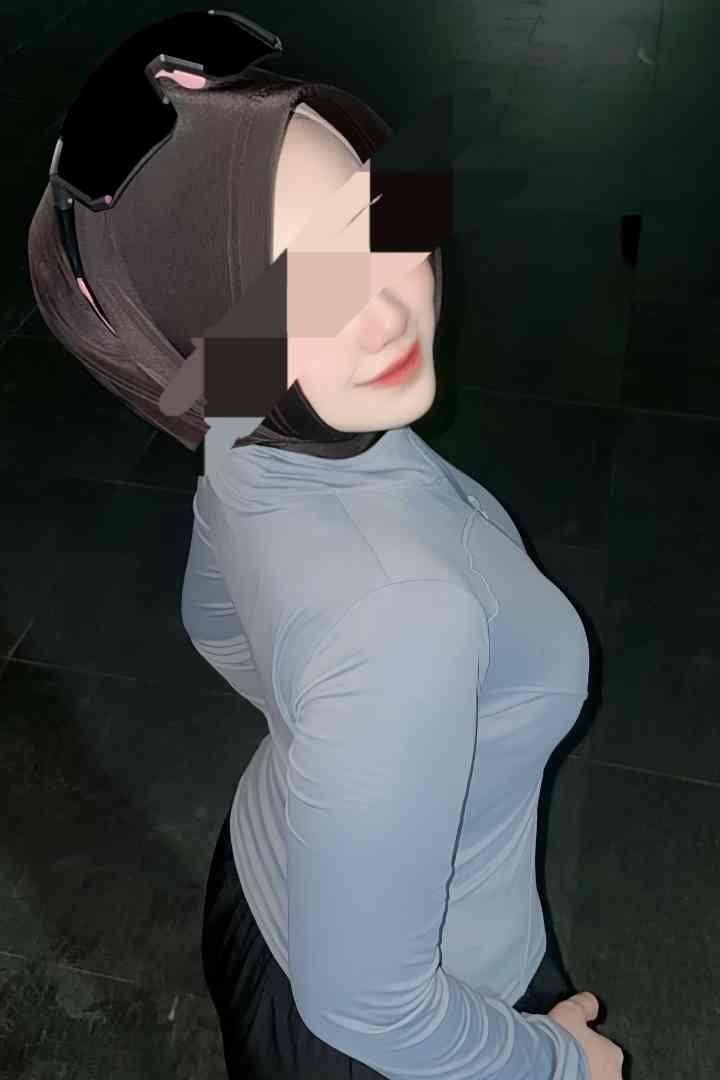 Woman in hijab and athletic wear. B2B Massages KL Escort potential client.