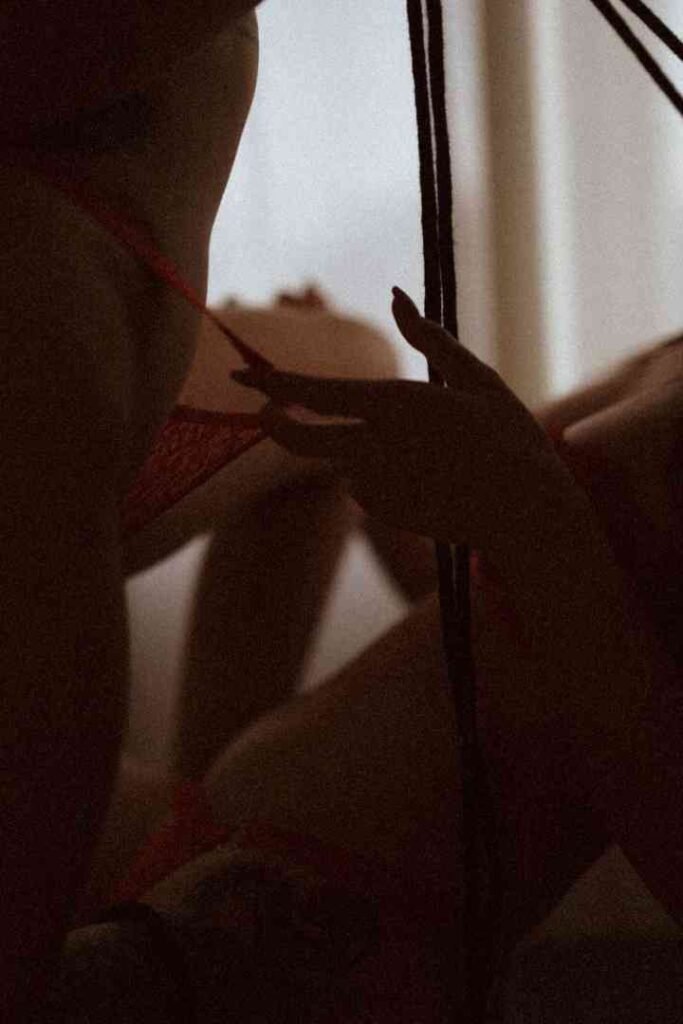 Close-up of two women, Viola and Cici, in intimate embrace