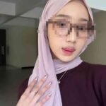 Woman in hijab and sunglasses