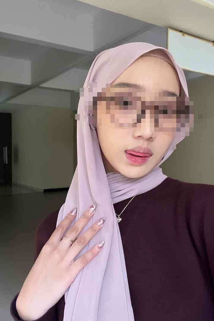 Woman in hijab and sunglasses