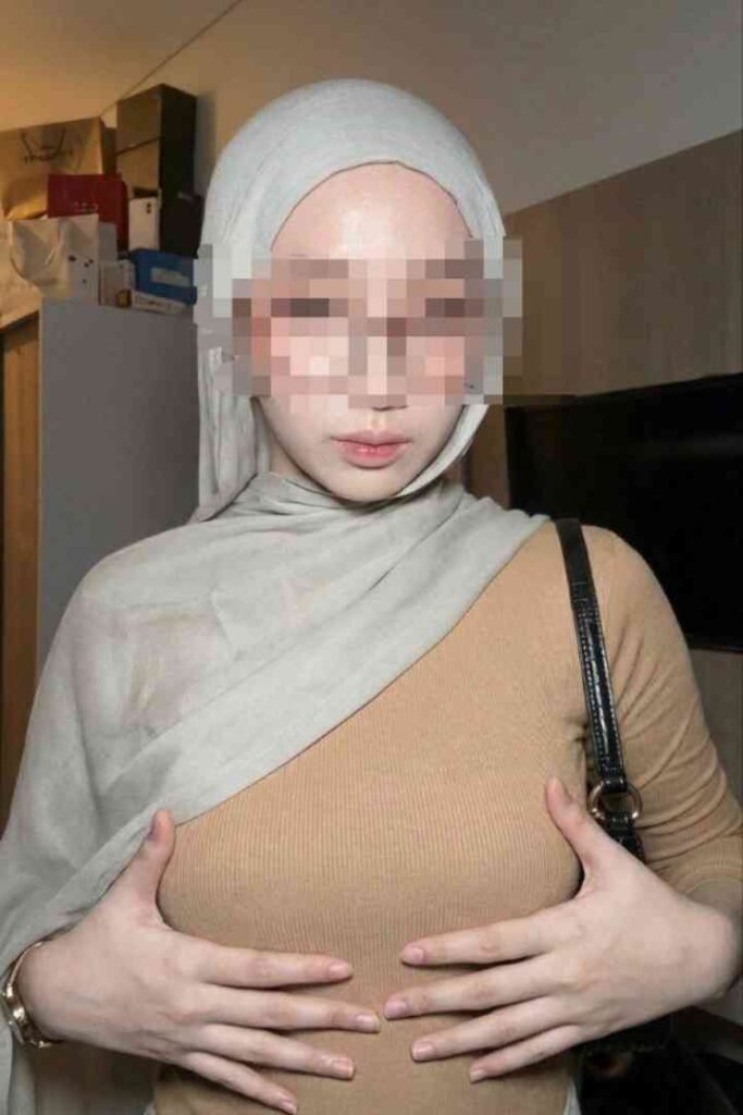 Young Malay woman in hijab and brown top, KL escort